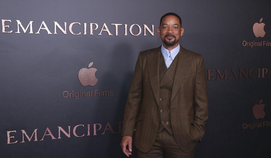 Will Smith poses for photographers upon arrival for the premiere of the film &#x27;Emancipation&#x27; in London, Friday, Dec. 2, 2022. (Photo by Vianney Le Caer/Invision/AP)