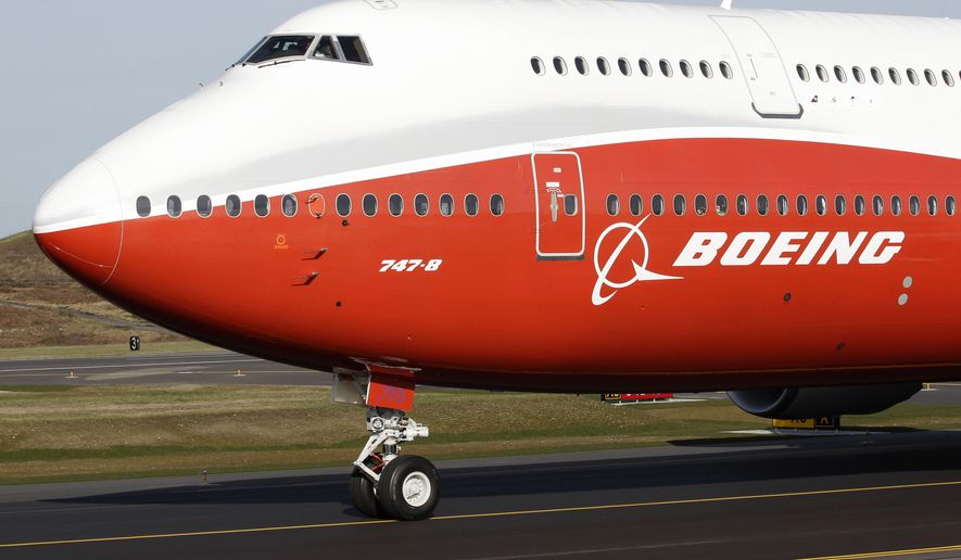 A Boeing 747-8, Boeing&#39;s new passenger plane, taxis for its first flight, Sunday, March 20, 2011, at Paine Field in Everett, Wash. After more than half a century, Boeing is rolling its last 747 out of a Washington state factory on Tuesday night. (AP Photo/Ted S. Warren, File)