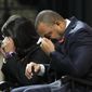 University of Virginia Athletic Director Carla Williams, left, and football coach Tony Elliott wipe tears from their eyes during a memorial service for three slain University of Virginia football players Lavel Davis Jr., D&#39;Sean Perry and Devin Chandler at John Paul Jones Arena at the school in Charlottesville, Va., Saturday, Nov. 19, 2022. (AP Photo/Steve Helber, Pool) **FILE**