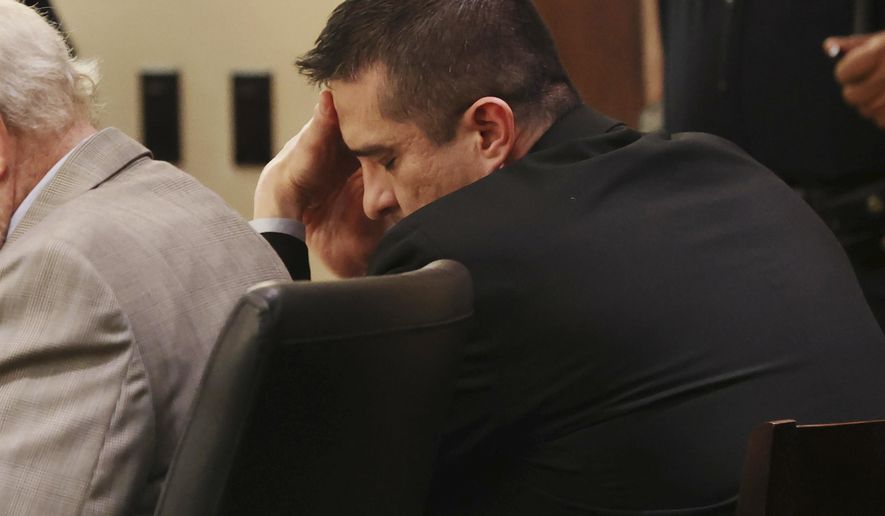 Former U.S. Border Patrol supervisor Juan David Ortiz reacts as recorder jail phone calls to his wife, Daniella, are played outside the presence of the jury during his capital murder trial at the Cadena-Reeves Justice Center in San Antonio, Texas, Tuesday, Dec. 6, 2022. (Jerry Lara/The San Antonio Express-News via AP)