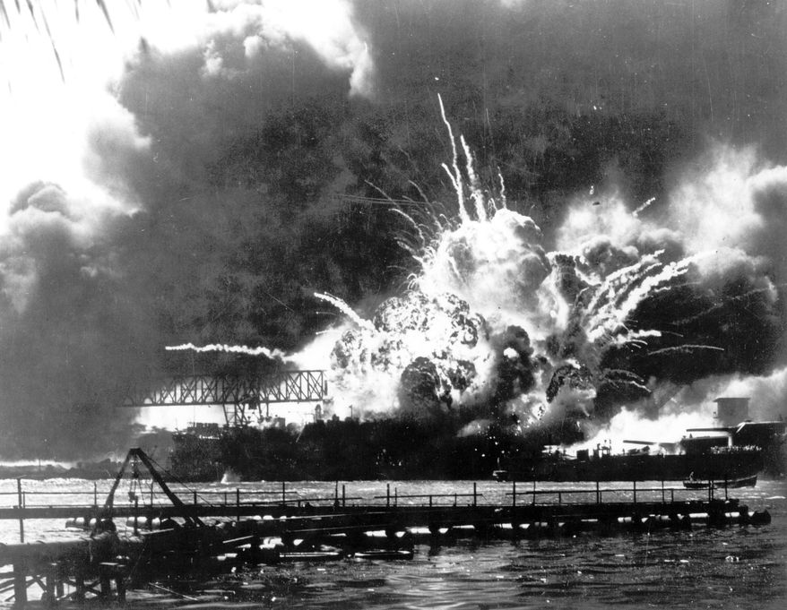 In this photo released by the U.S. Navy, the destroyer USS Shaw explodes after being hit by bombs during the Japanese surprise attack on Pearl Harbor, Hawaii, December 7, 1941. A few centenarian survivors of the attack on Pearl Harbor are expected to gather at the scene of the Japanese bombing on Wednesday, Dec. 7, 2022, to remember those who perished 81 years ago. (U.S. Navy via AP)