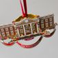 The White House Historical Association&#39;s 2022 Christmas Ornament, Tuesday, Dec 6, 2022 in Washington. The annual tree ornament is honors President Richard M. Nixon&#39;s administration and a nod to first lady Pat Nixon who first put a gingerbread house on display in the State Dining Room for the holiday season at the White House, long before its talented pastry chefs began making hundred-pound replicas of the executive mansion. (AP Photo/Pablo Martinez Monsivais)