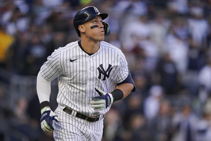 New York Yankees&#x27; Aaron Judge watches his solo home run ball during the second inning of Game 5 of an American League Division baseball series against the Cleveland Guardians, Oct. 18, 2022, in New York. Judge has agreed to return to the Yankees on a $360 million, nine-year contract, according to a person familiar with the deal. The person spoke to The Associated Press on Wednesday, Dec. 7, 2022 because the deal had not been announced. (AP Photo/Frank Franklin II, file)