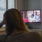 Georgia watches the Duke and Duchess of Sussex&#39;s controversial documentary being aired on Netflix at her home in Warwick, Britain, Thursday, Dec. 8, 2022. Britain’s monarchy is bracing for more bombshells to be lobbed over the palace gates as Netflix releases the first three episodes of a new series. The show “Harry &amp;amp; Meghan” promises to tell the “full truth” about Prince Harry and his wife Meghan’s estrangement from the royal family. The series debuted Thursday. (Jacob King/PA via AP)