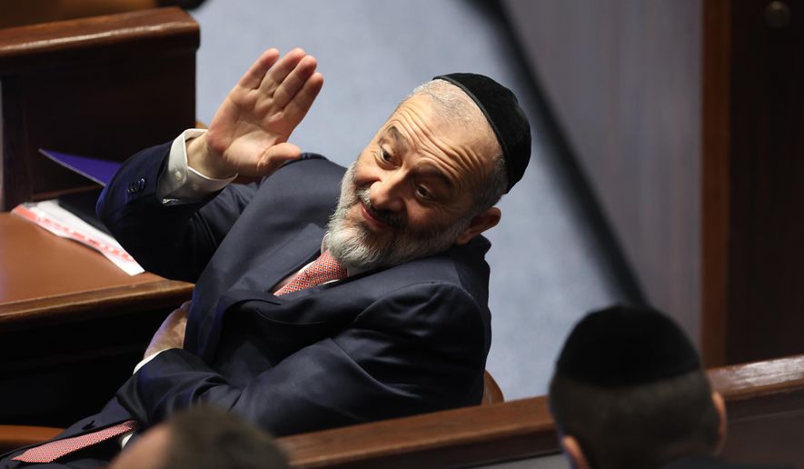 Member of Knesset Aryeh Deri waves during the swearing-in ceremony for Israeli lawmakers at the Knesset, Israel&#x27;s parliament, in Jerusalem, Tuesday, Nov. 15, 2022. Designated Prime Minister Benjamin Netanyahu&#x27;s Likud Party said Thursday, Dec. 8, 2022 it had reached a coalition deal with Shas, granting the ultra-Orthodox party control over several key ministries as it moved closer to forming a new government following Nov. 1 elections.(Abir Sultan/Pool Photo via AP, File)