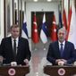 In this handout photo provided by the Turkish Defense Ministry, Turkish Defense Minister Hulusi Akar, right, and Finnish Defense Minister Antti Kaikkonen speak to the media after their talks in Ankara, Turkey, Thursday, Dec. 8, 2022. Kaikkonen visits Ankara, meets with his counterpart Akar as Ankara continues to hold up Helsinki&#x27;s bid to join NATO. (Turkish Defense Ministry via AP)