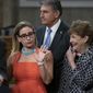 Sen. Kyrsten Sinema, D-Ariz., center, gestures during a news conference at the Capitol in Washington, Wednesday, July 28, 2021, while working on a bipartisan infrastructure bill with, from left, Sen. Rob Portman, R-Ohio, Sen. Joe Manchin, D-W.Va., and Sen. Jeanne Shaheen, D-N.H. Though elected as a Democrat, Sinema announced Friday, Dec. 9, that she has registered as an independent, but she does not plan to caucus with Republicans, ensuring Democrats will retain their narrow majority in the Senate. (AP Photo/J. Scott Applewhite) **FILE**