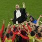 Morocco&#39;s head coach Walid Regragui is thrown in the air at the end of the World Cup round of 16 soccer match between Morocco and Spain, at the Education City Stadium in Al Rayyan, Qatar, Tuesday, Dec. 6, 2022. (AP Photo/Abbie Parr)