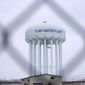 The Flint water plant tower is pictured on Jan. 6, 2022, in Flint, Mich. A judge dismissed criminal charges against former Michigan Gov. Rick Snyder in the Flint water crisis, months after the state Supreme Court said indictments returned by a one-person grand jury were invalid. (AP Photo/Carlos Osorio, File)