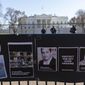 Signs and pictures of those killed, including journalist Brent Renaud, are displayed on a fence during a protest against Russia&#39;s invasion of Ukraine in Lafayette Park near the White House, Sunday, March 13, 2022, in Washington.  The International Federation of Journalists says 67 journalists and media staff have been killed around the world so far in 2022, up from 47 last year. (AP Photo/Alex Brandon, File)