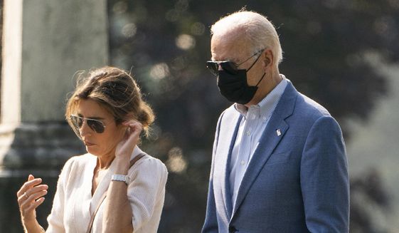 President Joe Biden leaves St. Joseph on the Brandywine Catholic Church in Wilmington, Del., with his daughter-in-law Hallie Biden after attending a Mass on Sunday, Oct. 3, 2021. (AP Photo/Manuel Balce Ceneta) **FILE**
