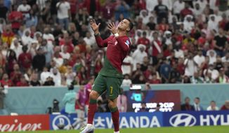 Portugal&#39;s Cristiano Ronaldo reacts after missing a scoring chance during the World Cup round of 16 soccer match between Portugal and Switzerland, at the Lusail Stadium in Lusail, Qatar, Tuesday, Dec. 6, 2022. (AP Photo/Alessandra Tarantino)