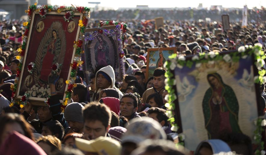 Pilgrims wait their turn to enter the Basilica of Guadalupe, in Mexico City, Dec. 12, 2013. Hundreds of thousands of people from all over the country converge on Mexico&#x27;s holy Roman Catholic site, many bringing with them images or statues of Mexico&#x27;s patron saint to be blessed, marking the Virgin&#x27;s Dec. 12 feast day. (AP Photo/Eduardo Verdugo, File)