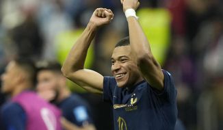 France&#39;s Kylian Mbappe celebrates at the end of the World Cup quarterfinal soccer match between England and France, at the Al Bayt Stadium in Al Khor, Qatar, Sunday, Dec. 11, 2022. France won 2-1. (AP Photo/Francisco Seco)