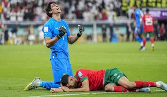 Morocco&#39;s goalkeeper Yassine Bounou, left, celebrates with his teammate Morocco&#39;s Achraf Hakimi their team victory over Portugal during the World Cup quarterfinal soccer match between Morocco and Portugal, at Al Thumama Stadium in Doha, Qatar, Saturday, Dec. 10, 2022. (AP Photo/Ariel Schalit) **FILE**