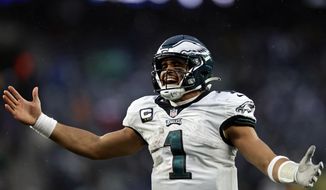 Philadelphia Eagles quarterback Jalen Hurts (1) reacts after a touchdown against the New York Giants during an NFL football game Sunday, Dec. 11, 2022, in East Rutherford, N.J. (AP Photo/Adam Hunger) **FILE**
