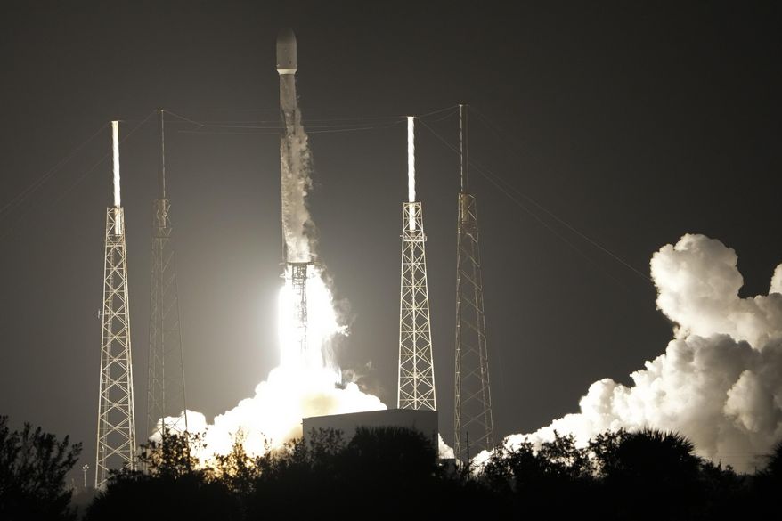 A SpaceX Falcon 9 rocket, with a payload including two lunar rovers from Japan and the United Arab Emirates, lifts off from Launch Complex 40 at the Cape Canaveral Space Force Station in Cape Canaveral, Fla., Sunday, Dec. 11, 2022. (AP Photo/John Raoux)