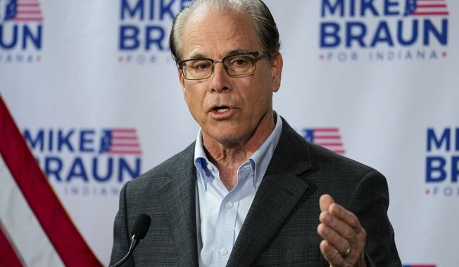 U.S. Sen. Mike Braun, R-Ind., announces in Indianapolis, Monday, Dec. 12, 2022 that he will run for Indiana governor in 2024. Braun will face Indiana Lt. Gov. Suzanne Crouch for the Republican nomination. (AP Photo/Michael Conroy)