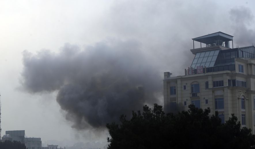 Smoke rises from a hotel building after an explosions and gunfire in the city of Kabul, Afghanistan, Monday, Dec. 12, 2022. A Taliban official says that a hotel building has come under a complex attack in the Afghan capital Kabul. (AP Photo)
