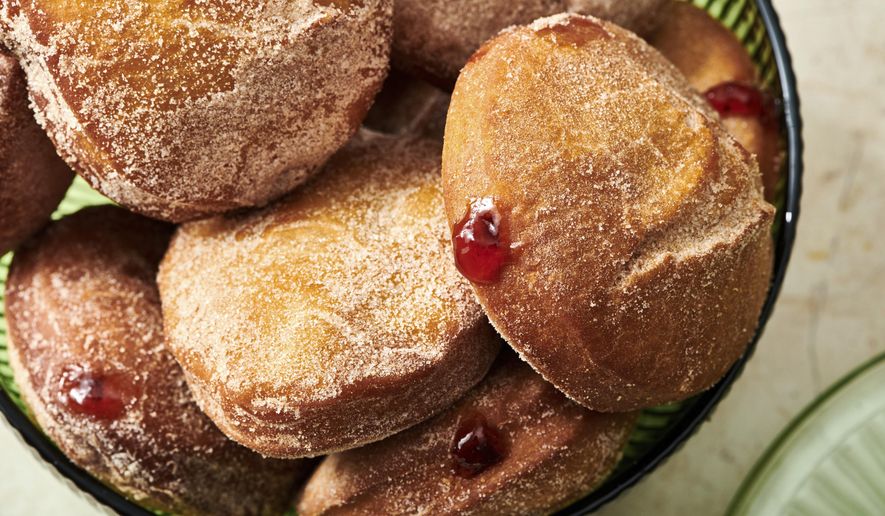 A plate of jelly doughnuts are displayed in New York on Nov. 15, 2021. In Jewish homes, jelly doughnuts are often enjoyed during Hanukkah and are known as Sufganiyot. (Cheyenne Cohen via AP)
