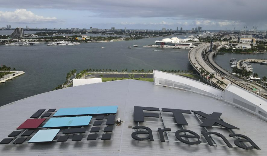 In this photo taken with a drone, the FTX logo is seen on the roof of the FTX Arena on Wednesday, Dec. 7, 2022, in Miami. The House Financial Services Committee holds a hearing on Tuesday on the collapse of cryptocurrency exchange FTX. (AP Photo/Rebecca Blackwell)