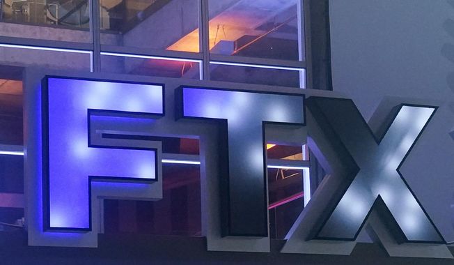 The FTX Arena logo is seen where the Miami Heat basketball team plays on Nov. 12, 2022, in Miami. The former CEO of failed crypto firm FTX Sam Bankman-Fried has been arrested in the Bahamas at the request of the U.S. government, the U.S. attorney’s office in New York said Monday, Dec. 12. (AP Photo/Marta Lavandier, File)
