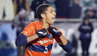 Syracuse&#39;s Amferny Sinclair (5) celebrates after scoring a penalty kick against Indiana to win the NCAA college soccer tournament final in Cary, N.C., Monday, Dec. 12, 2022. (AP Photo/Karl B DeBlaker)
