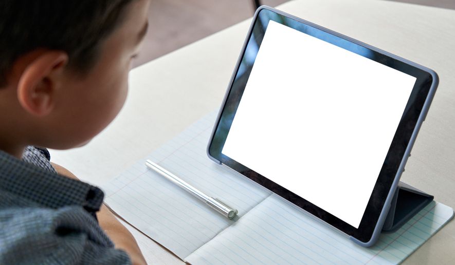 Online education, child using a tablet. Using smart devices to calm or occupy toddlers during tantrums could stunt their healthy emotional development and make them more volatile over time, according to a new study. File photo credit: Ground Picture via Shutterstock.