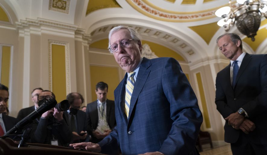 Senate Republican Leader Mitch McConnell, R-Ky., joined at right by Senate Republican Whip John Thune, R-S.D., finishes remarks to reporters following a closed-door policy meeting, at the Capitol in Washington, Tuesday, Dec. 13, 2022. (AP Photo/J. Scott Applewhite)