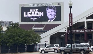 The video board at Davis Wade Stadium displays a message in memory of Mississippi State NCAA college football coach Mike Leach, Tuesday, Dec. 13, 2022, in Starkville, Miss. Leach, 61, died Monday night, Dec. 12, at the University of Mississippi Medical Center in Jackson following complications from a heart condition, the university announced. (Theo DeRosa/The Commercial Dispatch, via AP)