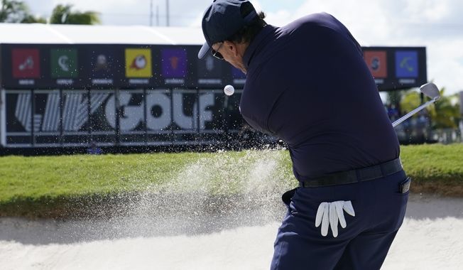 FILE - Phil Mickelson hits from a sand trap on the ninth hole during the first round of the LIV Golf Team Championship at Trump National Doral Golf Club, Oct. 28, 2022, in Doral, Fla. (AP Photo/Lynne Sladky, File)