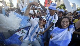 Argentina soccer fans celebrate their team&#39;s victory over Croatia at the end of the team&#39;s World Cup semifinal match in Qatar after watching it on TV in Buenos Aires, Argentina, Tuesday, Dec. 13, 2022. (AP Photo/Gustavo Garello)