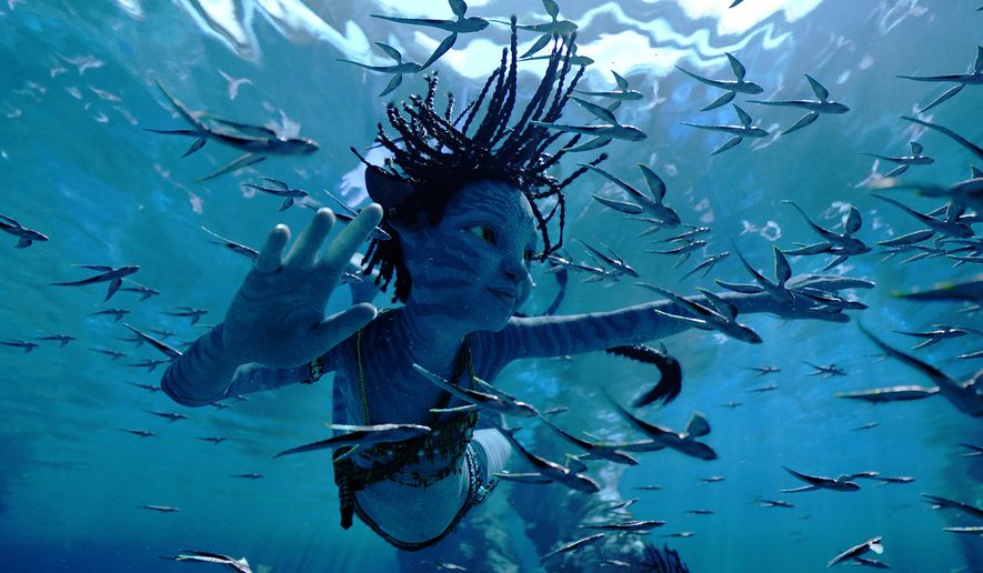 This image released by 20th Century Studios shows Trinity Bliss, as Tuk, in a scene from "Avatar: The Way of Water." (20th Century Studios via AP)