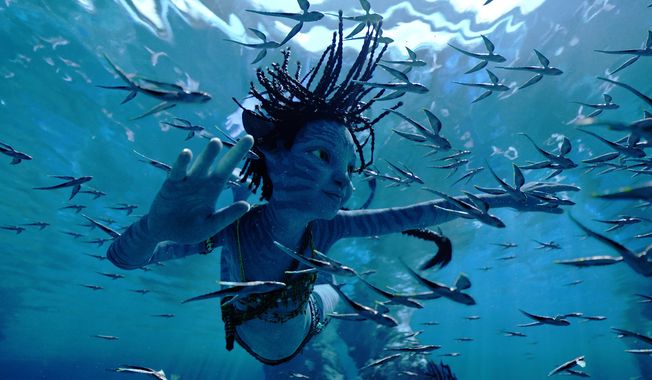 This image released by 20th Century Studios shows Trinity Bliss, as Tuk, in a scene from "Avatar: The Way of Water." (20th Century Studios via AP)
