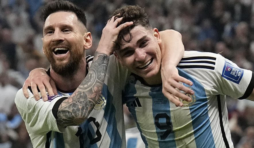 Argentina&#x27;s Lionel Messi, left, and Argentina&#x27;s Julian Alvarez celebrate after scoring during the World Cup semifinal soccer match between Argentina and Croatia at the Lusail Stadium in Lusail, Qatar, Tuesday, Dec. 13, 2022. (AP Photo/Martin Meissner)
