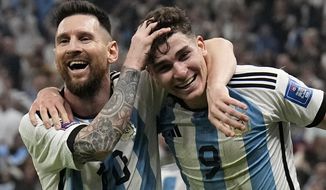 Argentina&#39;s Lionel Messi, left, and Argentina&#39;s Julian Alvarez celebrate after scoring during the World Cup semifinal soccer match between Argentina and Croatia at the Lusail Stadium in Lusail, Qatar, Tuesday, Dec. 13, 2022. (AP Photo/Martin Meissner)