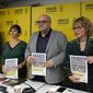 The director in Amnesty International in Spain, Esteban Beltran, centre, holds an Amnesty report on migrant deaths alongside Amna Guellali, Amnesty International deputy Director for the Middle East and North Africa, left, and Agnes Callamard, Secretary General of Amnesty International during an Amnesty international news conference on their investigation of the deaths at the Melilla border in June, Madrid, Spain, Tuesday, Dec. 13, 2022. Amnesty International said Tuesday that a failure by Morocco and Spain to properly investigate the deaths of more than 20 migrants at the border of Spanish enclave city of Melilla in northwest Africa in June “smacks of a cover-up and racism.” (AP Photo/Paul White)