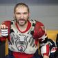Washington Capitals&#x27; Alex Ovechkin holds his 798, 799, and 800th career goal pucks in the locker room after an NHL hockey game against the Chicago Blackhawks Tuesday, Dec. 13, 2022, in Chicago. (AP Photo/Charles Rex Arbogast) **FILE**