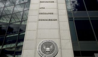 The U.S. Securities and Exchange Commission building in Washington is pictured on Aug. 5, 2017. The government on Wednesday, Dec. 14, 2022, charged eight men of earning more than $100 million in stock market profits by manipulating their novice-investor followers on social media. The Department of Justice and the Securities and Exchange Commission said that from early 2020 to around April of this year the men, who had combined following of over 1.5 million on Twitter, ran a “pump-and-dump” scheme. (AP Andrew Harnik, File)