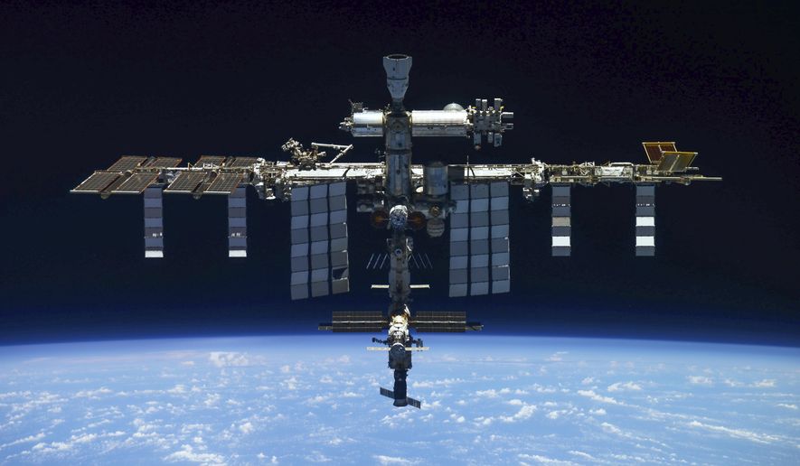 In this handout photo released by Roscosmos Space Agency Press Service, a view of the International Space Station taken on March 30, 2022 by crew of Russian Soyuz MS-19 space ship after undocking from the Station. NASA and Russia&#x27;s space agency canceled a spacewalk by two Russian cosmonauts, Sergey Prokopyev and Dmitri Petelin, just as they were preparing to exit the International Space Station late Wednesday, Dec. 14 because of an apparent coolant leak from an attached space capsule. (Roscosmos Space Agency Press Service via AP, File)