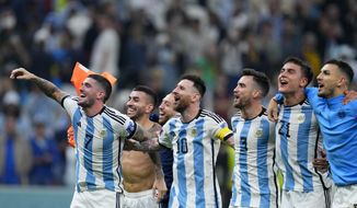 Argentina&#39;s Lionel Messi (10) and teammates celebrate after defeating Croatia 3-0 in a World Cup semifinal soccer match at the Lusail Stadium in Lusail, Qatar, Tuesday, Dec. 13, 2022. (AP Photo/Natacha Pisarenko)