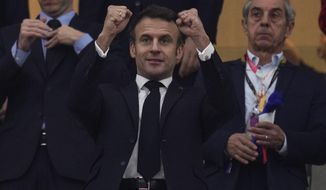 French president Emmanuel Macron gestures during the World Cup semifinal soccer match between France and Morocco at the Al Bayt Stadium in Al Khor, Qatar, Wednesday, Dec. 14, 2022. (AP Photo/Manu Fernandez)