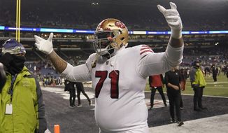 San Francisco 49ers offensive tackle Trent Williams (71) celebrates after the 49ers defeated the Seattle Seahawks in an NFL football game in Seattle, Thursday, Dec. 15, 2022. (AP Photo/Marcio Jose Sanchez)