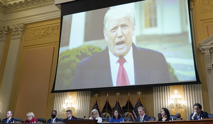 A video of President Donald Trump is shown on a screen, as the House select committee investigating the Jan. 6 attack on the U.S. Capitol holds a hearing at the Capitol in Washington, July 21, 2022. The House committee investigating the Capitol riot will hold its final meeting Monday, Dec. 19, wrapping up its year-and-a-half-long inquiry by asking the Justice Department to investigate potential crimes. (AP Photo/J. Scott Applewhite) **FILE**
