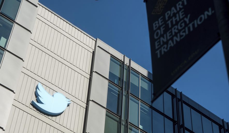A Twitter logo hangs outside the company&#x27;s San Francisco offices on Tuesday, Nov. 1, 2022. A German official who won a defamation case against Twitter this week has dedicated his legal victory to Dr. Anthony Fauci, the top U.S. infectious disease expert targeted by the microblogging site&#x27;s new owner, Elon Musk. (AP Photo/Noah Berger, file)