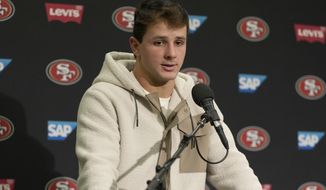 San Francisco 49ers quarterback Brock Purdy speaks at a news conference after the 49ers defeated the Seattle Seahawks in an NFL football game in Seattle, Thursday, Dec. 15, 2022. (AP Photo/Stephen Brashear)
