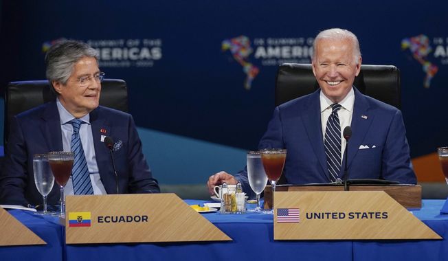 President Joe Biden sits beside Ecuador President Guillermo Lasso during a leaders&#x27; retreat and working luncheon with heads of state and government at the Summit of the Americas, June 10, 2022, in Los Angeles. Biden met Monday, Dec. 19, with Lasso at the White House. (AP Photo/Evan Vucci, File)