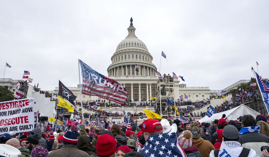 Rioters loyal to President Donald Trump rally at the U.S. Capitol in Washington on Jan. 6, 2021. (AP Photo/Jose Luis Magana) **FILE**