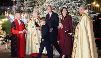 Britain&#39;s Prince William and Kate, Princess of Wales, arrive with their children Princess Charlotte and Prince George for the &#39;Together at Christmas&#39; Carol Service at Westminster Abbey in London, Thursday, Dec. 15, 2022. (James Manning/PA via AP)