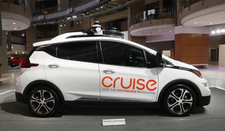 In this Jan. 16, 2019, photo, Cruise AV, General Motor&#39;s autonomous electric Bolt EV is displayed in Detroit. US safety regulators are investigating reports that autonomous robotaxis run by General Motors&#39; Cruise LLC can stop too quickly or unexpectedly stop moving, potentially stranding passengers. (AP Photo/Paul Sancya, File)
